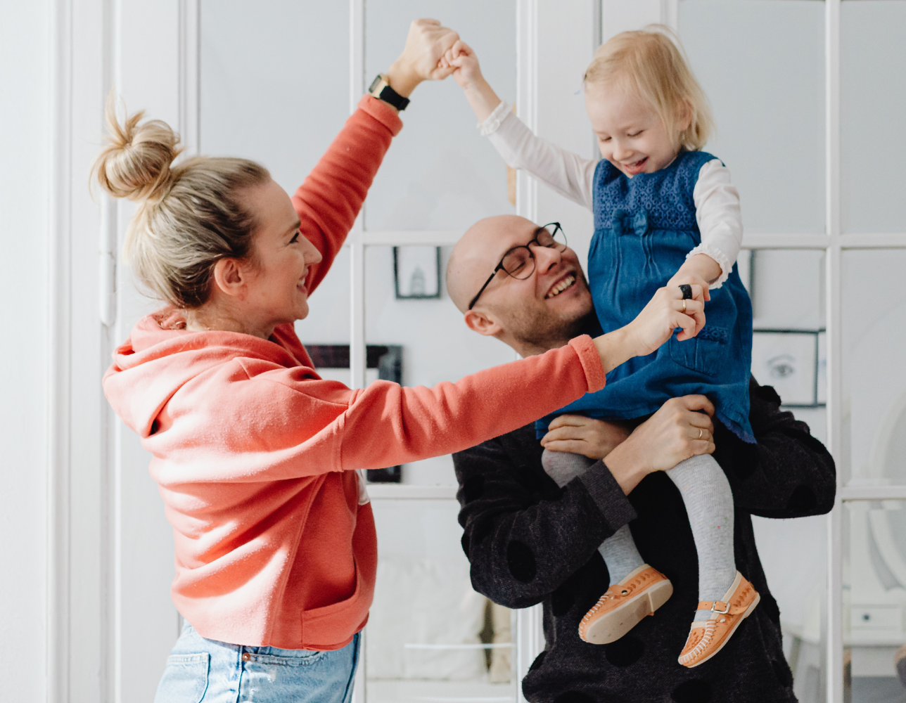 Happy family celebrating in their new home